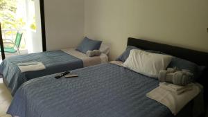 1 dormitorio con 2 camas en Casa en condominio, en Girardot