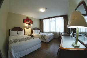 Postel nebo postele na pokoji v ubytování Hotel Republica + 37 fotografií