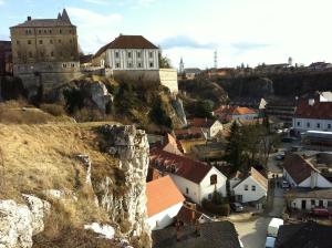 a town with a castle on top of a mountain at Galeria Villa in Veszprém