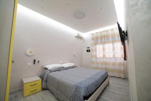 Posteľ alebo postele v izbe v ubytovaní B&B La Colonna