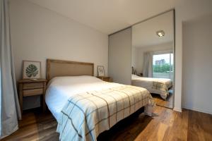Postelja oz. postelje v sobi nastanitve Apartamento Amalfi