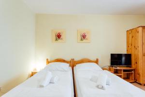 Ένα ή περισσότερα κρεβάτια σε δωμάτιο στο Orava Hotel