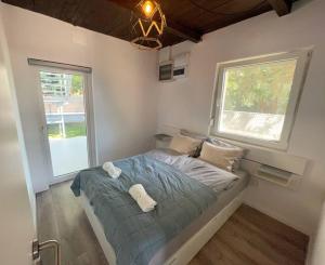 Posteľ alebo postele v izbe v ubytovaní Felix House Siófok