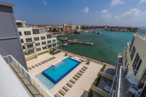 a view of a body of water from a building at Aruba Dreams, Take Me Away Studio in Oranjestad