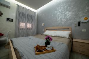 Posteľ alebo postele v izbe v ubytovaní B&B La Colonna