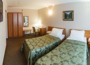Кровать или кровати в номере Гостиница Булгар