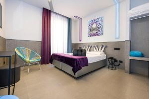 Łóżko lub łóżka w pokoju w obiekcie Hotel Relais Dei Papi