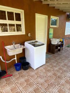 a bathroom with a sink and a sink at Morada dos Coqueiros in Garopaba +56 photos