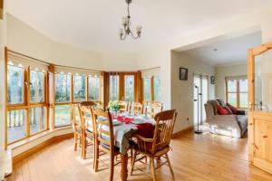 a dining room with a table and chairs at Yellow House in Westport