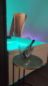 a bowl and a wine glass on a table at NICOLAUS SUITE Wellness Experience in Bari Palese