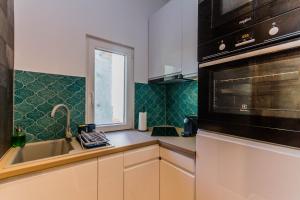 Kuchyňa alebo kuchynka v ubytovaní Chain Bridge Studio Apartment
