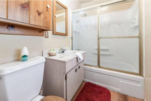 a bathroom with a sink and a shower at Paradise Cabin in Big Bear City +30 photos