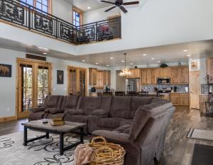 a living room with a couch and a table at East Zion Trails Retreat-Hot tub, Resort Amenities, Exceptional in Orderville