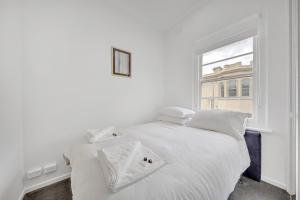 Postel nebo postele na pokoji v ubytování Grosvenor 3121 Richmond