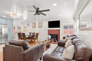 a living room with a couch and a table at Goleta Getaway in Santa Barbara