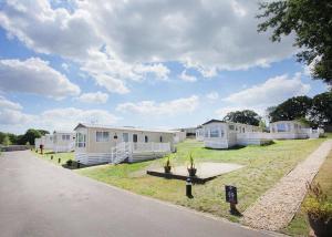 a row of mobile homes on the side of a road at Mercury Yacht Harbour And Holiday Park in Lower Swanwick