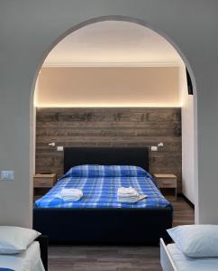 Rúm í herbergi á Albergo Baffo