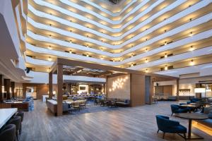 a rendering of a restaurant with a large ceiling at Madison Marriott West in Middleton