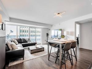 a living room with a couch and a table at Luxury Condo on Bay Street in Toronto
