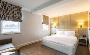 Postel nebo postele na pokoji v ubytování Radisson Blu Hotel, London Mercer Street