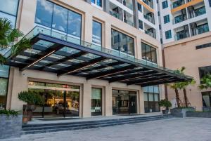 a building with a walkway in front of it at Best Western Premier Sapphire Ha Long in Ha Long