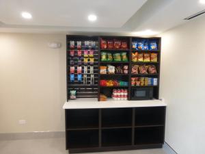 a food pantry with a shelf with food and drinks at Red Roof Inn Bourbonnais in Bourbonnais