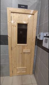 a wooden box with a window in a bathroom at EZI homestay Vista Bangi in Kajang