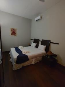 Hotel Villa Salvador tesisinde bir odada yatak veya yataklar