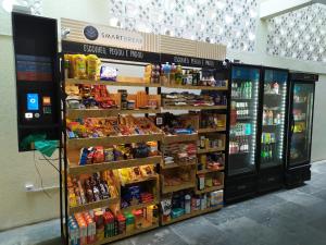 a grocery store with a large display of food and drinks at Studio 1608 in São Paulo