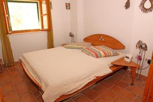 En eller flere senge i et værelse på Apartments Mima Hvar