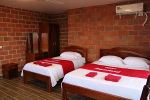 Voodi või voodid majutusasutuse Hotel International toas