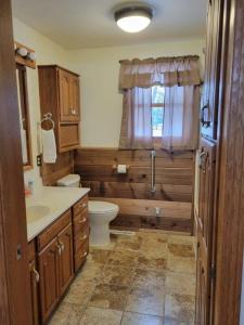 a bathroom with a toilet and a sink at Mallory Estate in Chariton