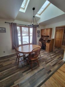 a kitchen with a table and chairs in a room at Mallory Estate in Chariton