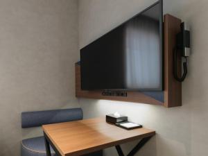 Et tv og/eller underholdning på Comfort Hotel Yokkaichi