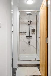 a shower with a glass door in a bathroom at Great North Getaways - Newcastle upon Tyne in Jesmond