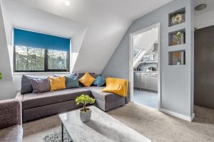 a living room with a couch and a table at Great North Getaways - Newcastle upon Tyne in Jesmond