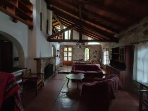 a living room with a couch and a fireplace at Casa Soleares in Villa Las Rosas