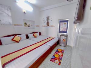 Postel nebo postele na pokoji v ubytování Minh Hiền Hotel