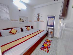 Postel nebo postele na pokoji v ubytování Minh Hiền Hotel