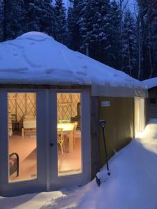 a snow covered greenhouse with a table in it at Gollé Goulu in Saint Come