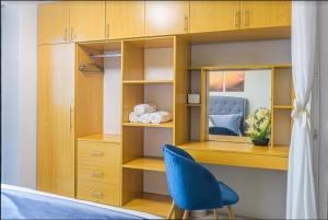 a room with a desk and a blue chair at 1 bedroom condo unit at Sundance Residences in Cebu City +18 photos