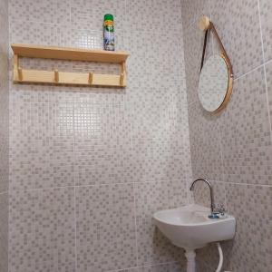 a bathroom with a sink and a mirror at Chales do delta Piauí in Parnaíba +61 photos