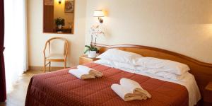 Postel nebo postele na pokoji v ubytování Parc Hotel