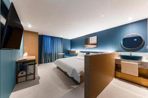 Ένα ή περισσότερα κρεβάτια σε δωμάτιο στο Brown Dot Hotel Cheonan Buldang