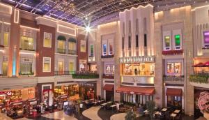 an indoor shopping mall with many shops and restaurants at 2 BR Condo Apartment near NAIA 3 Pasay City in Manila