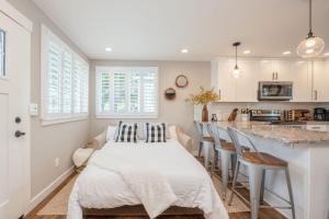 a kitchen with a large white table in a room at Montara Beach Mountain Escape in Montara