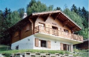 a large house with a balcony on top of it at Chalet Solina in Icogne