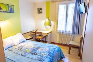 Postel nebo postele na pokoji v ubytování Le Clos Grand