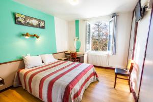 Postel nebo postele na pokoji v ubytování Le Clos Grand