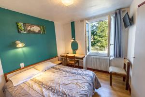 Postel nebo postele na pokoji v ubytování Le Clos Grand
